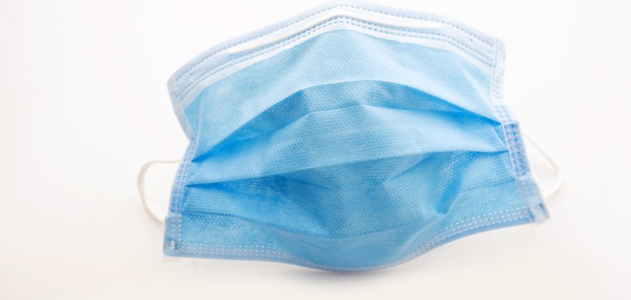 Health mask for protection against viruses and dust on a white background Mund-Nasen Maske