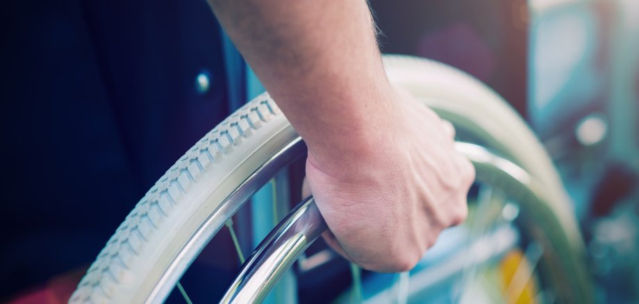 Disabled man on a wheelchair Behinderter Mann im Rollstuhl