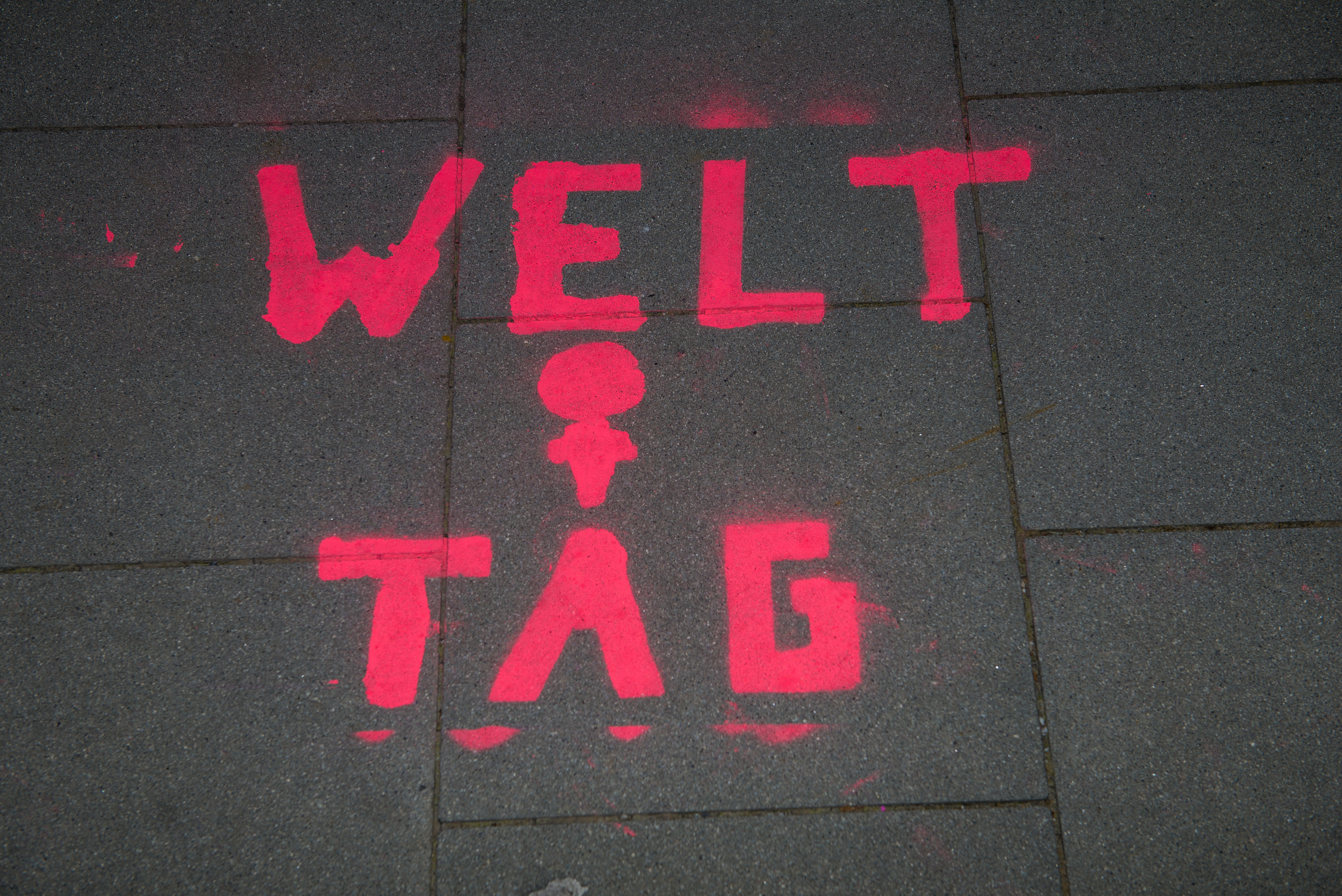 Graffiti in german on a sidewalk on occasion of international women's day.