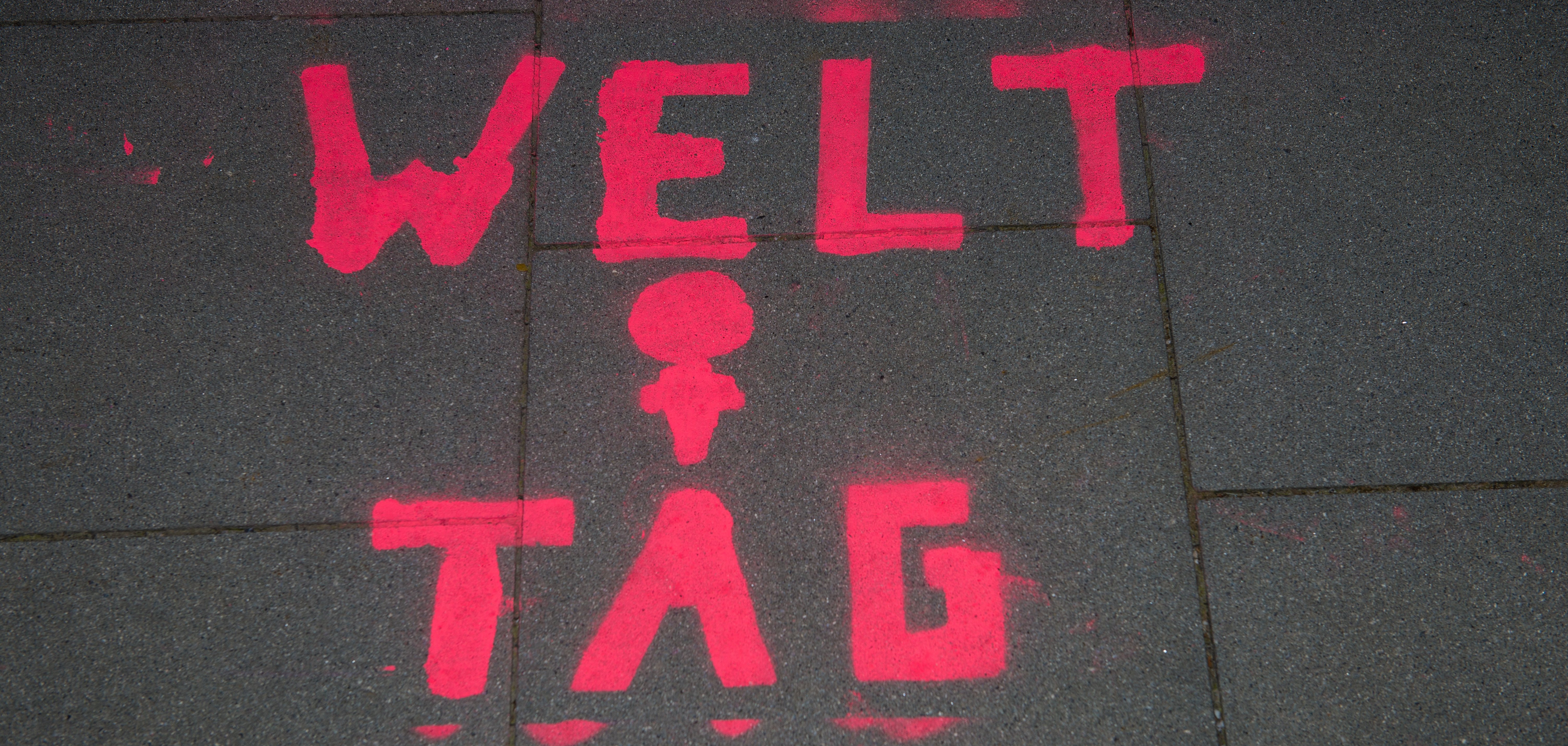 Graffiti in german on a sidewalk on occasion of international women's day.