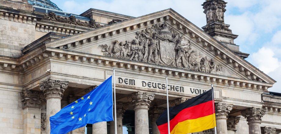 German Reichstag in Berlin, Germany, with national flags