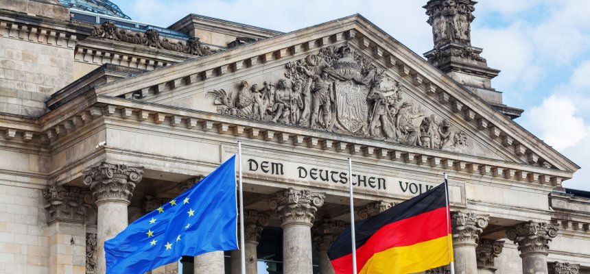 German Reichstag in Berlin, Germany, with national flags German Reichstag in Berlin, Germany, with national flags